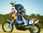 Chris riding in the wet sandy conditions in Tunisia Africa testing for the 2006 Dakar Rally. (FREE Wallpaper)