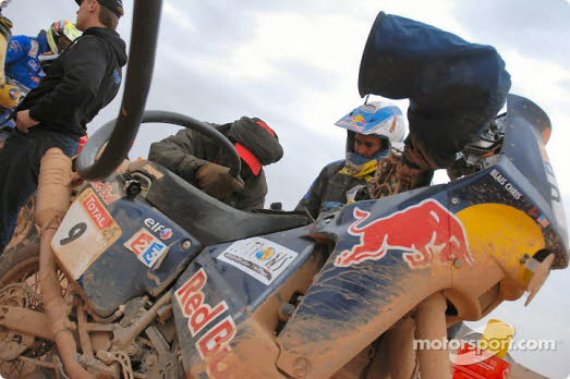 Chris in stage 6, getting his bike filled with gas