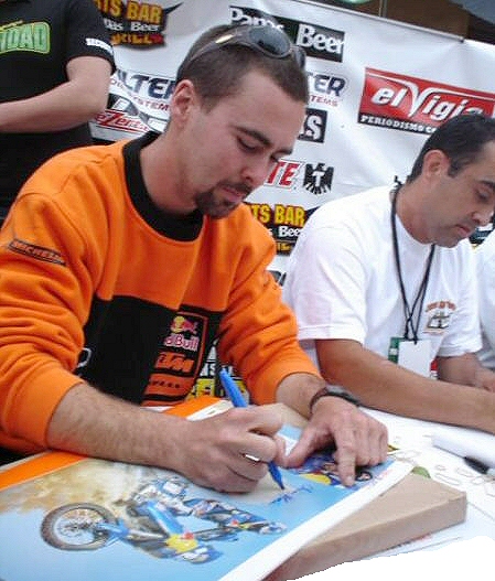 Chris signing his Dakar Rally Posters at the Baja 500  